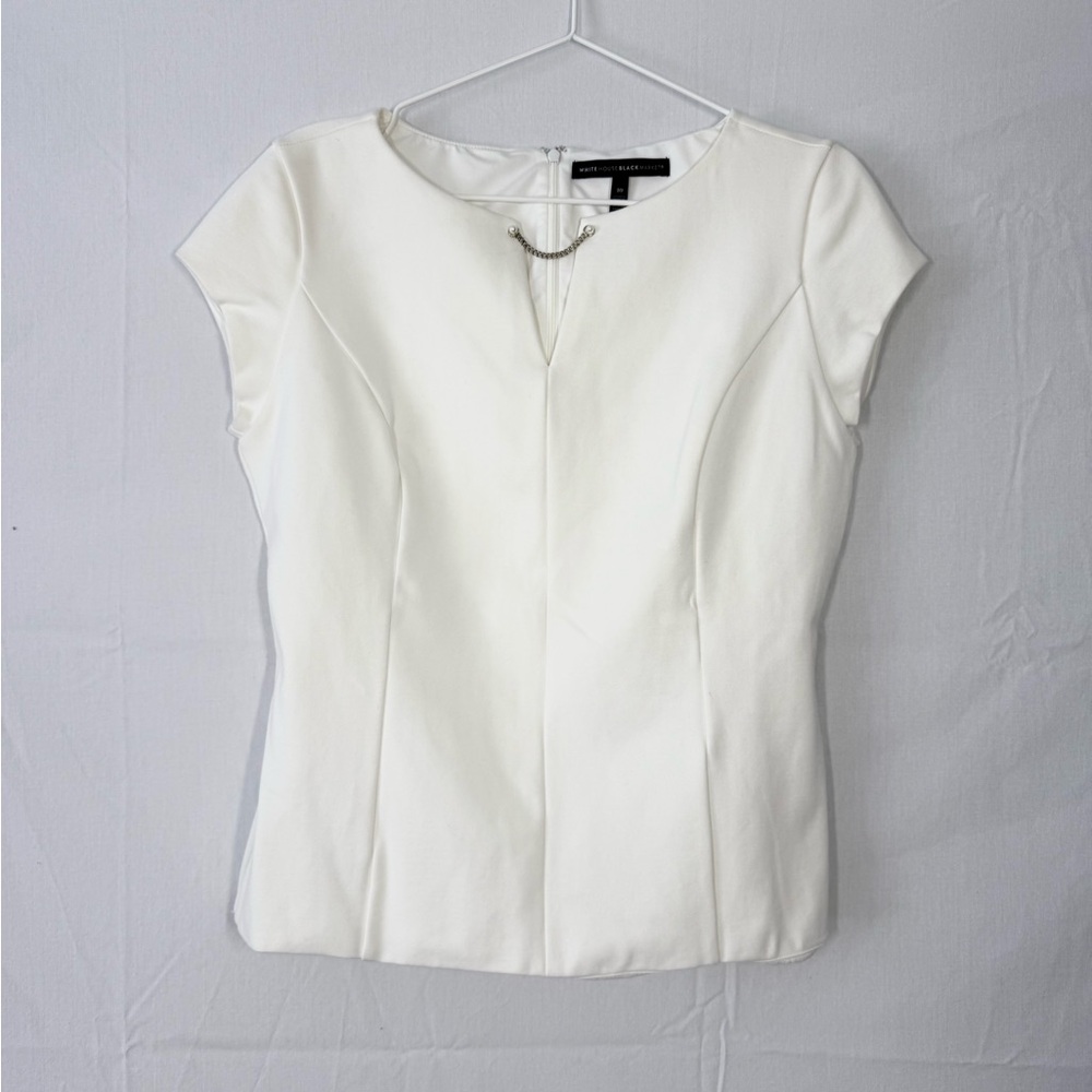 NWOT White House Black Market Ivory Blouse with cap sleeves and Chain Detail